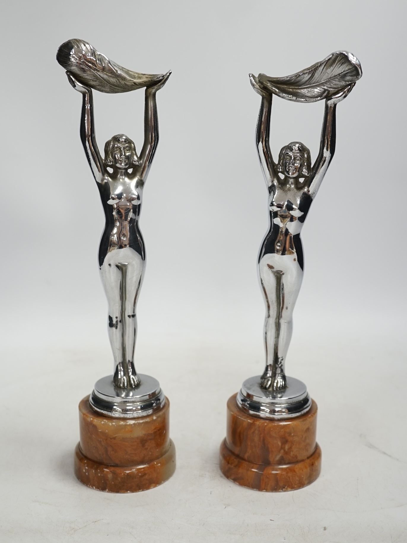 A pair of Art Deco chrome plated figures on onyx bases, 30cm. Condition - poor